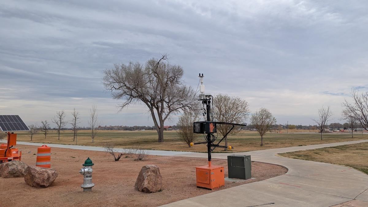 Camera mast near road work barrels