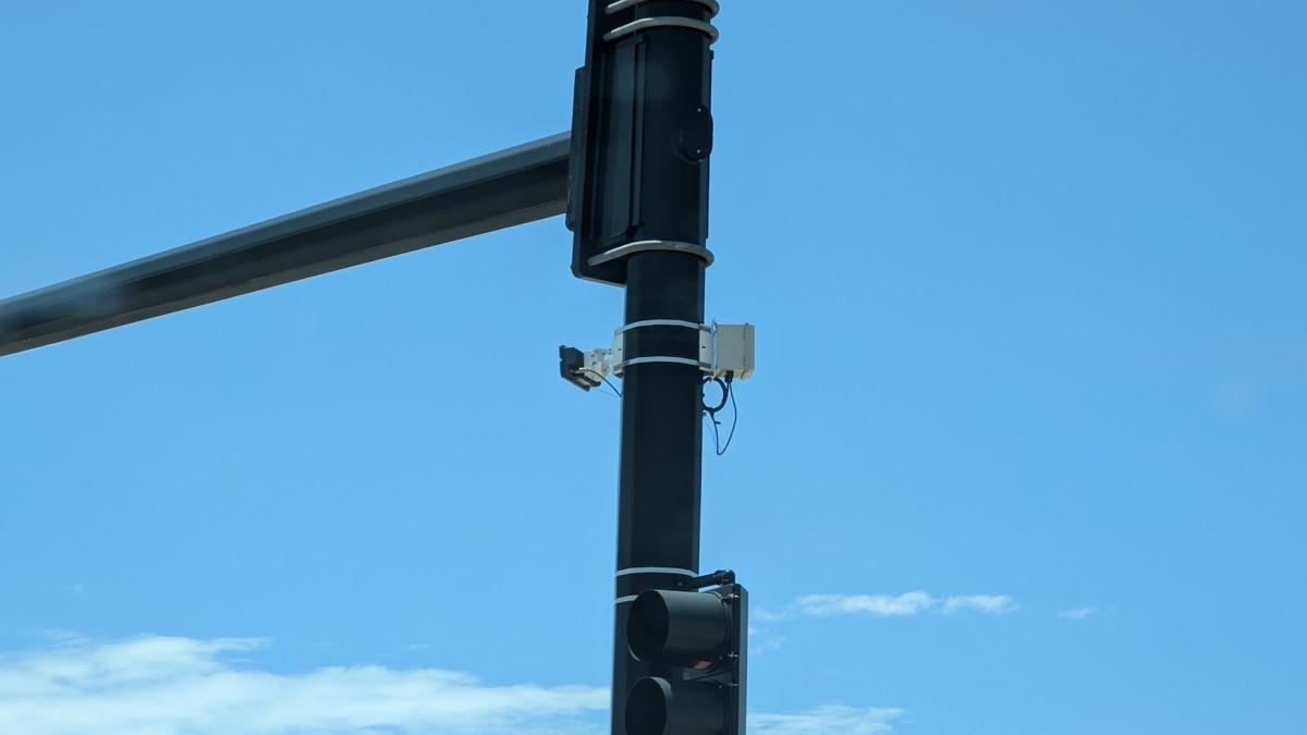 Signal mast arm with a mounted sensor