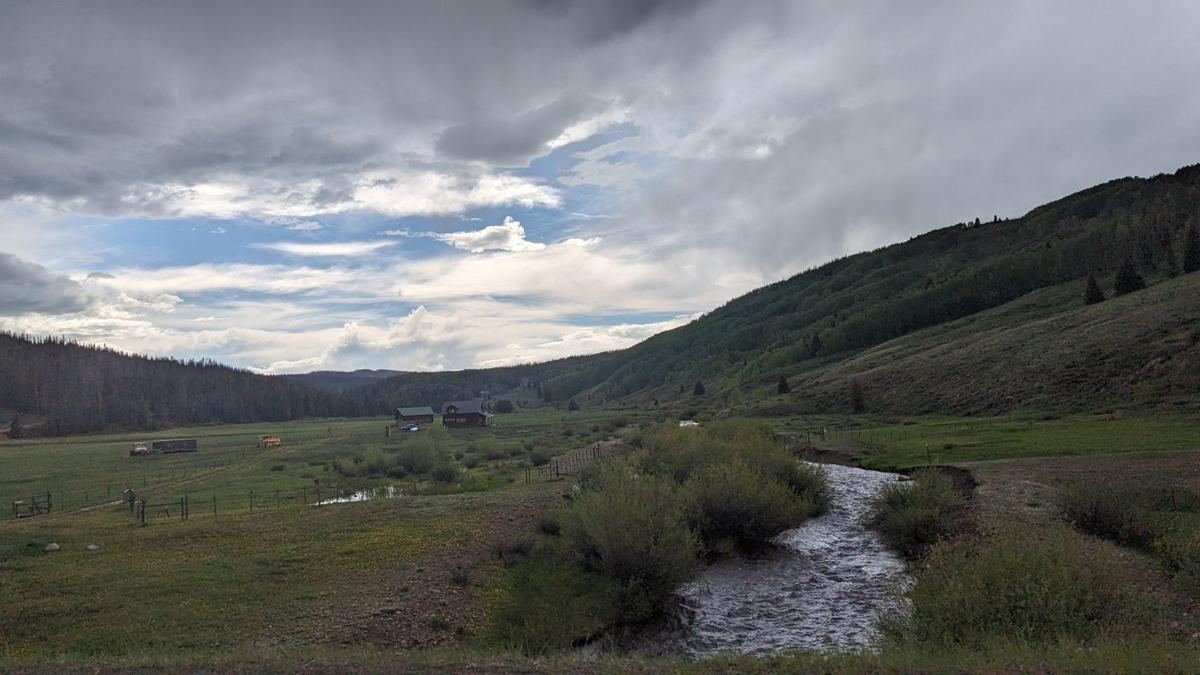 Creek winding through a mountain valley