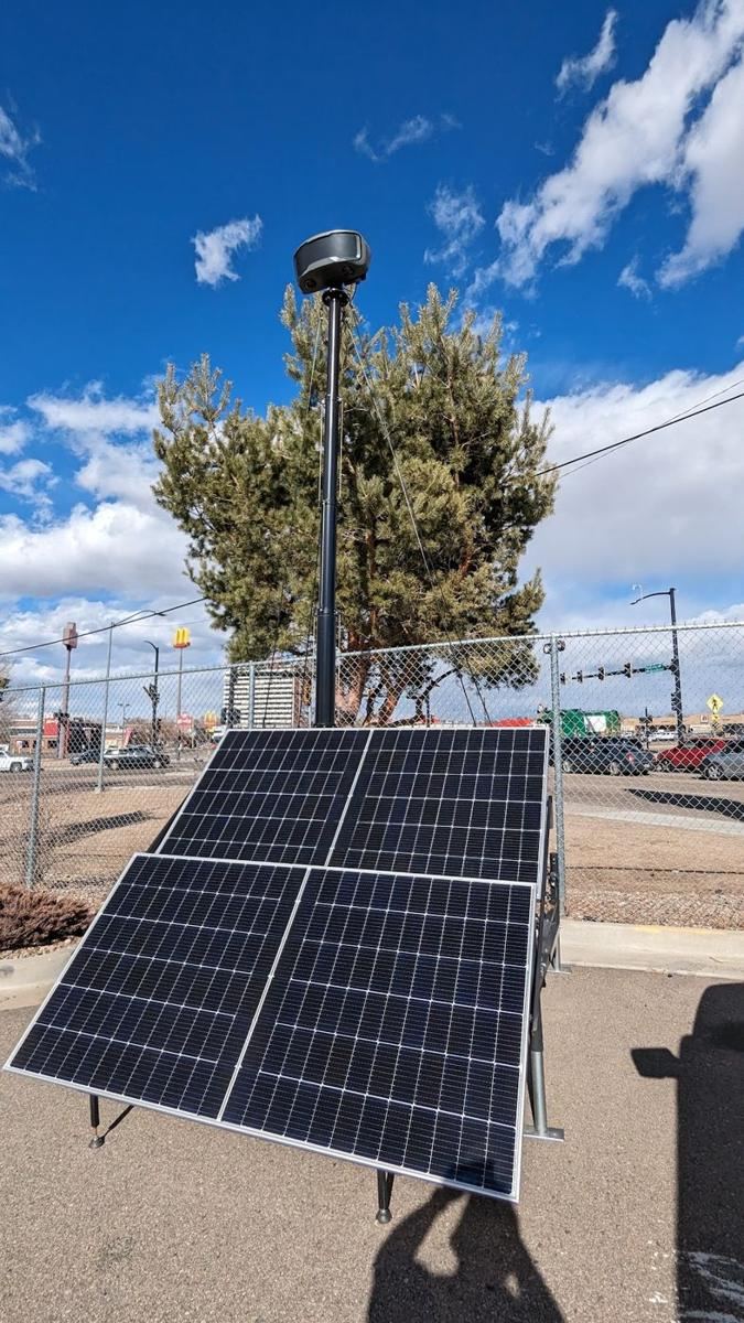 Solar array below a camera mast